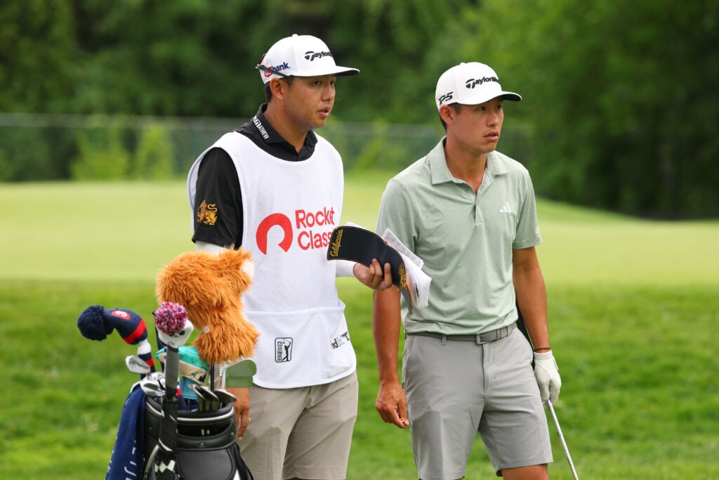 Collin Morikawa with his caddy during practice at the 2025 Rocket Classic
