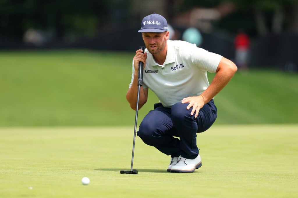 Wyndham Clark lines up a putt in round one of the Rocket Classic