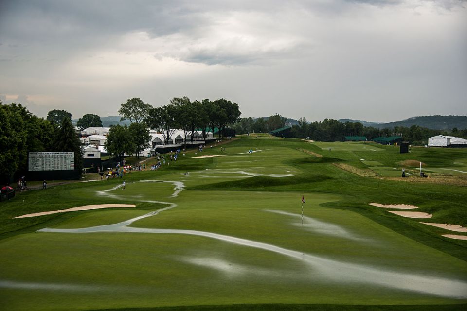 OAKMONT, PA - JUNE 16:  A course scenic view of flooding on the 18th hole green and fairway after play was suspended during the first round of the U.S. Open at Oakmont Country Club on June 16, 2016 in Oakmont, Pennsylvania. (Photo by Keyur Khamar/PGA TOUR)