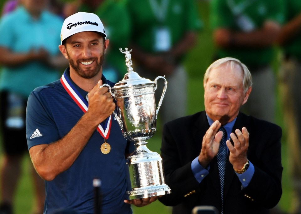OAKMONT, PA - JUNE 19:  Dustin Johnson of the United States celebrates with the winner's trophy alongside Jack Nicklaus after winning the U.S. Open at Oakmont Country Club on June 19, 2016 in Oakmont, Pennsylvania.  (Photo by Ross Kinnaird/Getty Images)