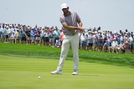 Scottie Scheffler reacts to his putt on the first hole during the first round of the U.S....