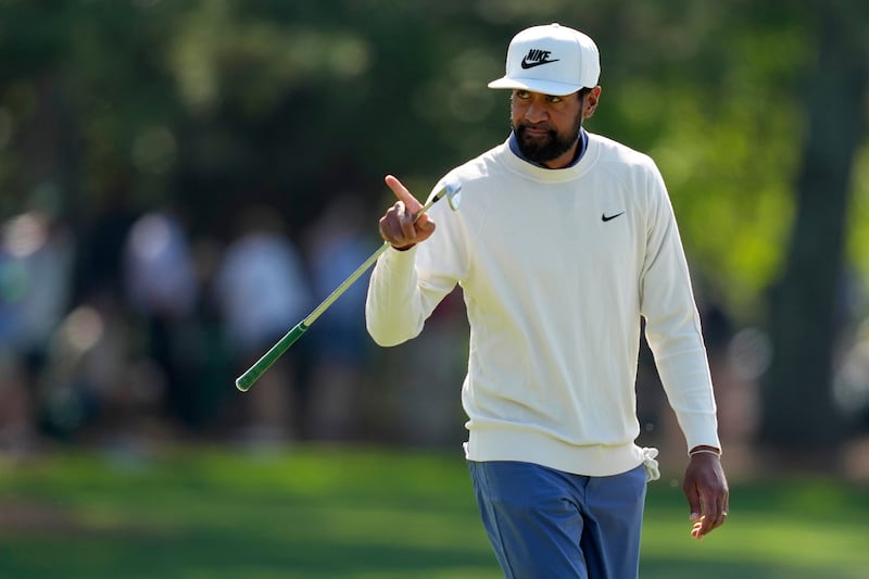 Tony Finau points to the gallery on the first hole during the first round at the Masters golf tournament, Thursday, April 10, 2025, in Augusta, Ga.