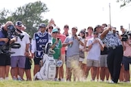 Crowd watch Patrick Reed of 4Aces GC hits from the 15th fairway during the second day of LIV...