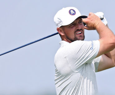 Bryson DeChambeau plays an iron shot