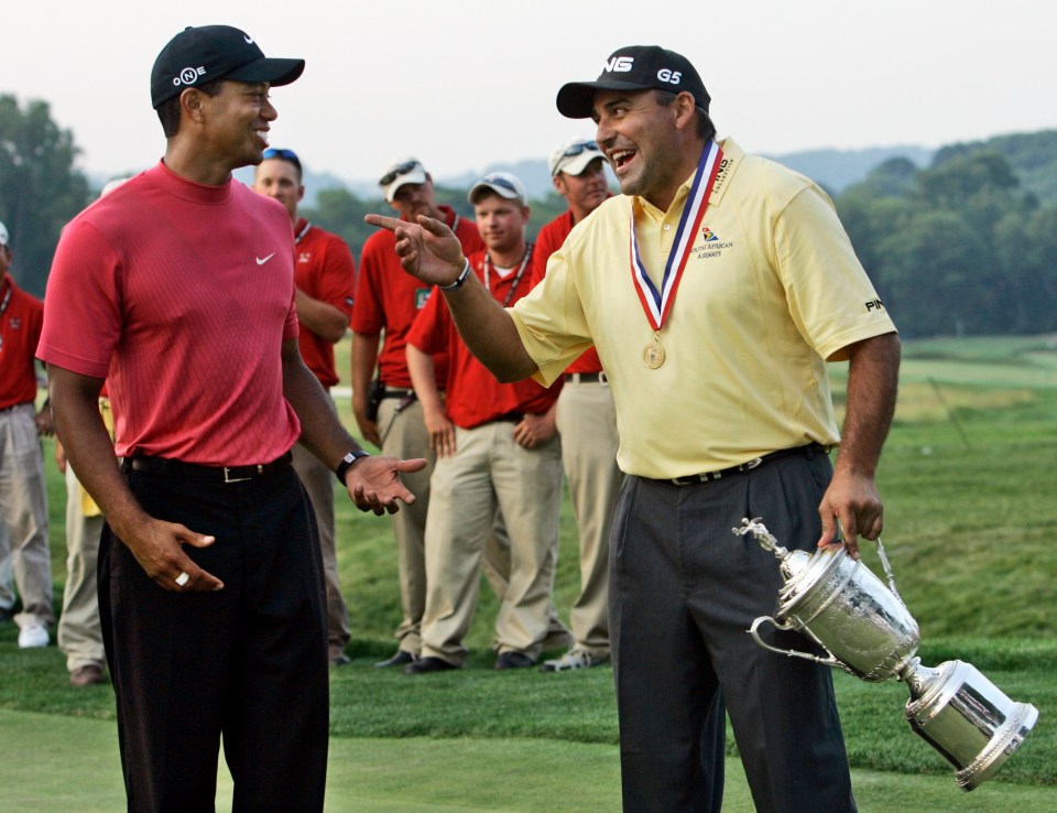 Angel Cabrera, winner of the 107th U.S. Open, jokes with Tiger Woods.
