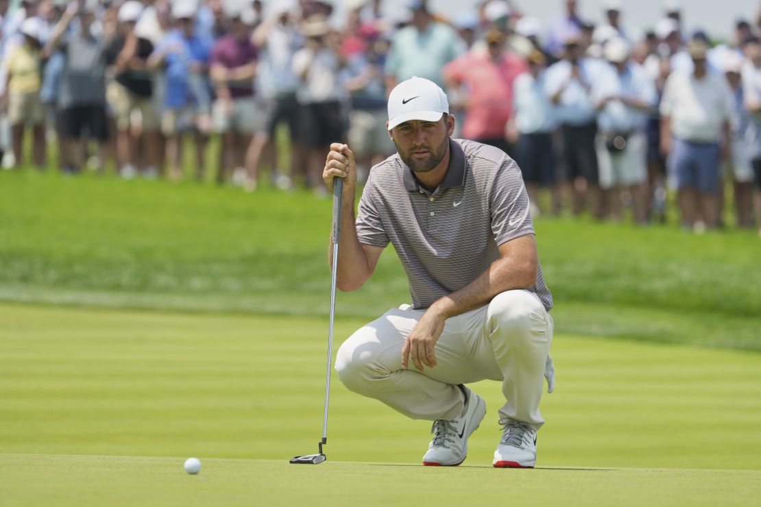 Scottie Scheffler lines up a putt on the first hole during the first round of the U.S. Open.