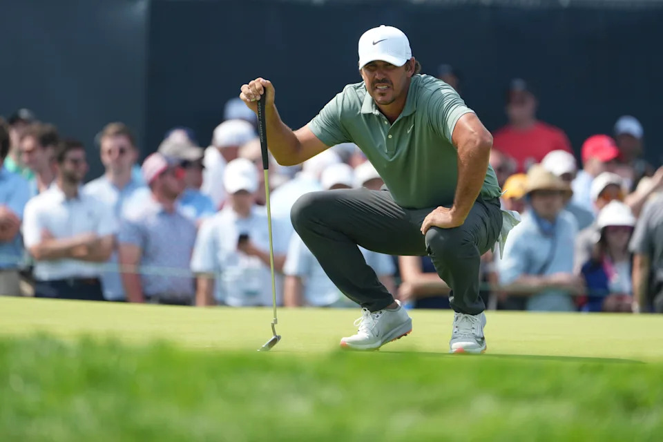 Brooks Koepka lines up a putt on the ninth hole during the first round of the U.S. Open golf tournament at Oakmont Country Club Thursday, June 12, 2025, in Oakmont, Pa. (AP Photo/Gene J. Puskar)