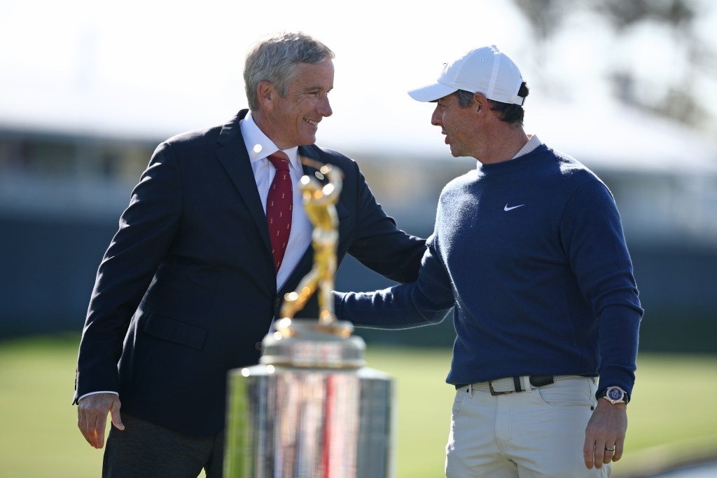 Jay Monahan, Commissioner of the PGA TOUR, congratulates Rory McIlroy of Northern Ireland for winning the playoff in the final round of THE PLAYERS Championship on the Stadium Course at TPC Sawgrass on March 17, 2025