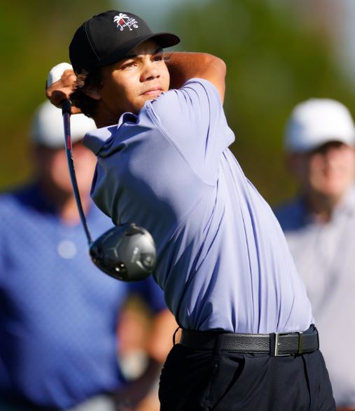 Golfer taking a swing.