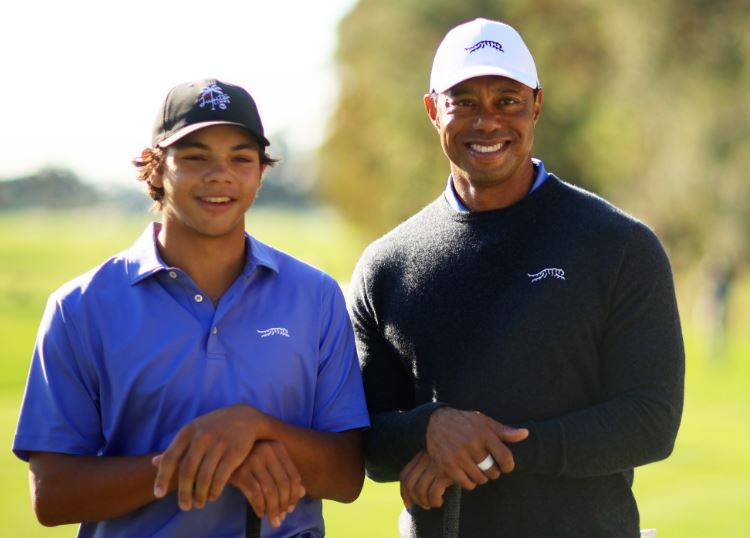 Tiger Woods and his son on a golf course.