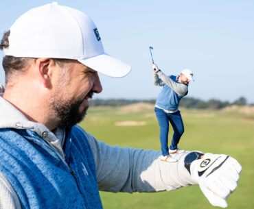 Peter Finch looking at his Shot Scope GPS watch, reading 150 yards from his position in the fairway to the pin, with a smaller inset image of Peter Finch appearing to stand on his own arm while at the top of his backswing with an iron
