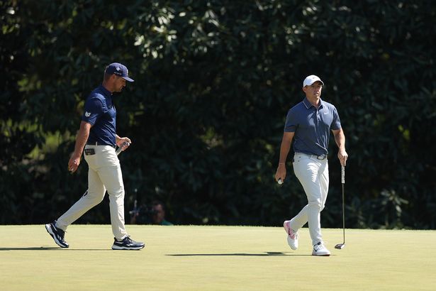 Bryson DeChambeau of the United States and Rory McIlroy of Northern Ireland walk on the fifth green during the final round of the 2025 Masters Tournament at Augusta National Golf Club on April 13, 2025 in Augusta, Georgia