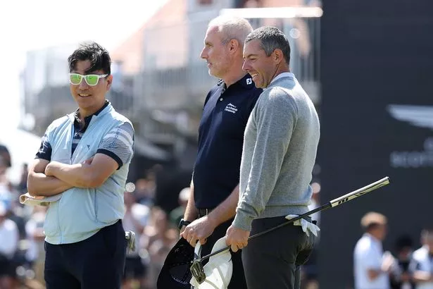 Rory McIlroy of Northern Ireland looks on alongside Jae Youl Kim and Chris Hewitt during the pro-am prior to the Genesis Scottish Open 2025 at The Renaissance Club on July 09, 2025 in North Berwick, Scotland