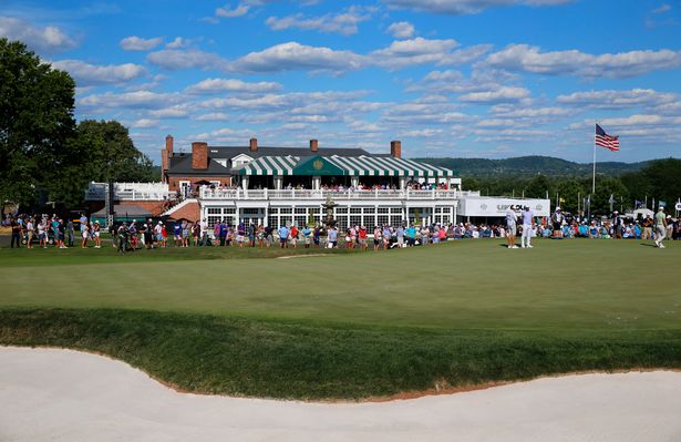 BEDMINSTER, NEW JERSEY - JULY 30: A general view of the 15th green is seen as team Captain Dustin Johnson of 4 Aces GC waits with caddie Austin Johnson during day two of the LIV Golf Invitational - Bedminster at Trump National Golf Club Bedminster on July 30, 2022 in Bedminster, New Jersey. (Photo by Jonathan Ferrey/LIV Golf via Getty Images)