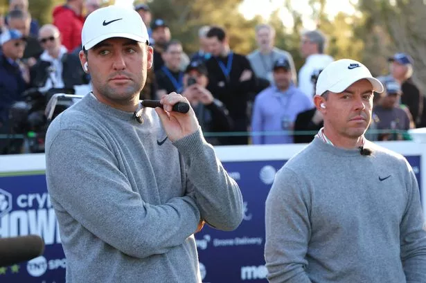 Scottie Scheffler (L) and Rory McIlroy of the PGA Tour look on during The Showdown: McIlroy and Scheffler v DeChambeau and Koepka at Shadow Creek Golf Course