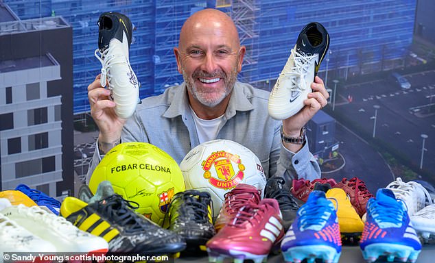 John Horne shows off some of the signed football boots in his collection
