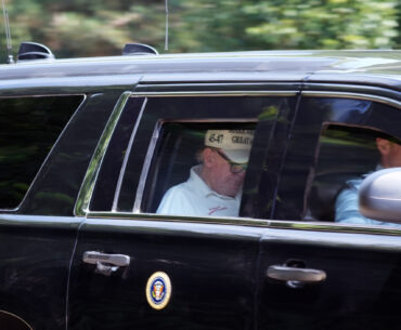 Donald Trump wearing reading glasses