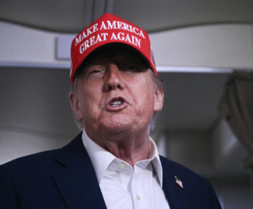 President Donald Trump speaks to journalists