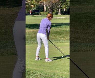 Golfers golfing