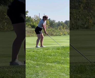 Golfers golfing