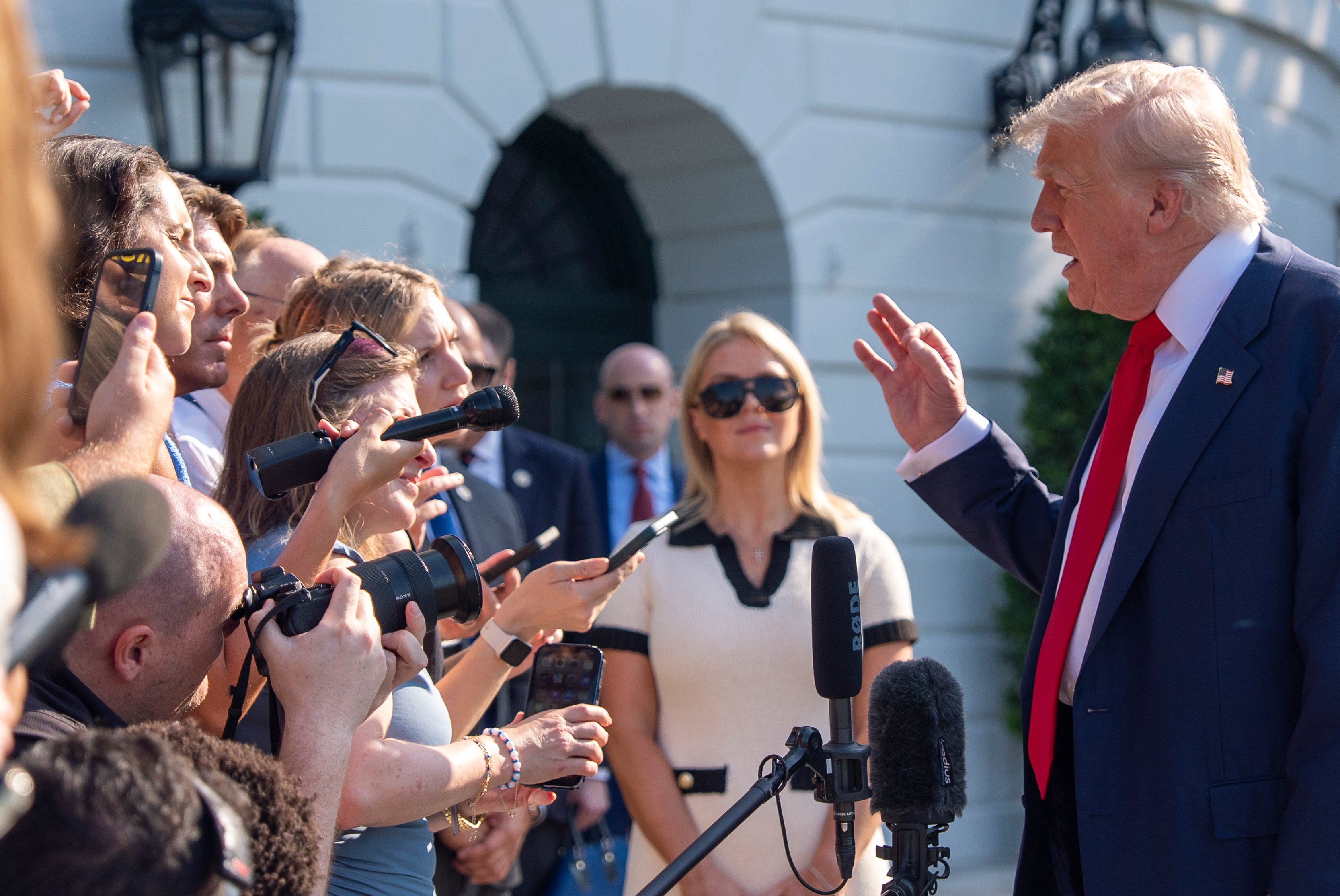 Donald Trump speaks to reporters on the South Lawn of the White House