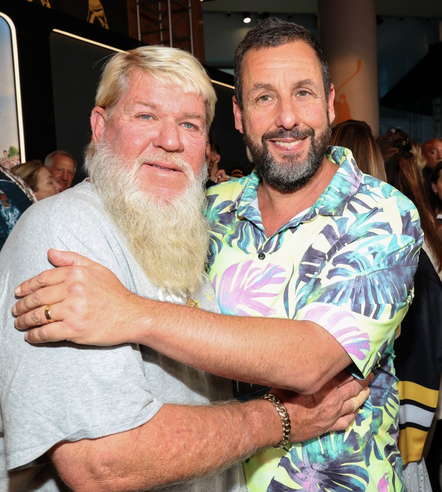 John Daly and Adam Sandler at a premiere.