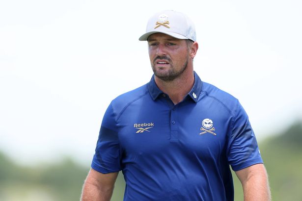 Bryson DeChambeau looks on