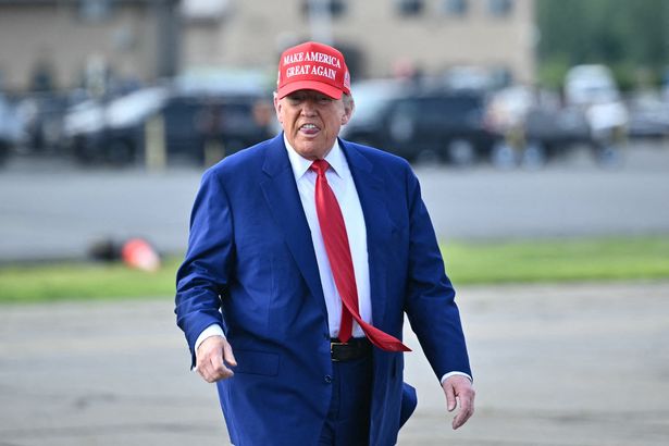 US President Donald Trump makes his way to board Air Force One at Morristown Municipal Airport in Morristown, New Jersey, on June 21, 2025 as he returns to the White House from his golf club in Bedminster, New Jersey. (Photo by Mandel NGAN / AFP) (Photo by MANDEL NGAN/AFP via Getty Images)