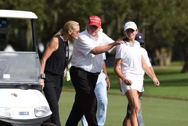 Former President Donald Trump, center walks with his niece Kai Trump and her mom Vanessa Trump during the ProAm ahead of the LIV Golf Team Championship, on October. 27, 2022, at Trump National Doral Golf Club in Doral, FL.