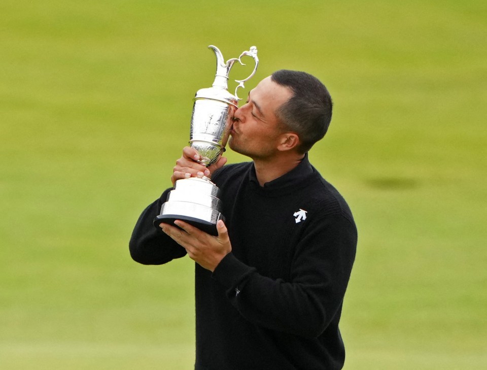 Xander Schauffele kissing the Claret Jug after winning The Open Championship.