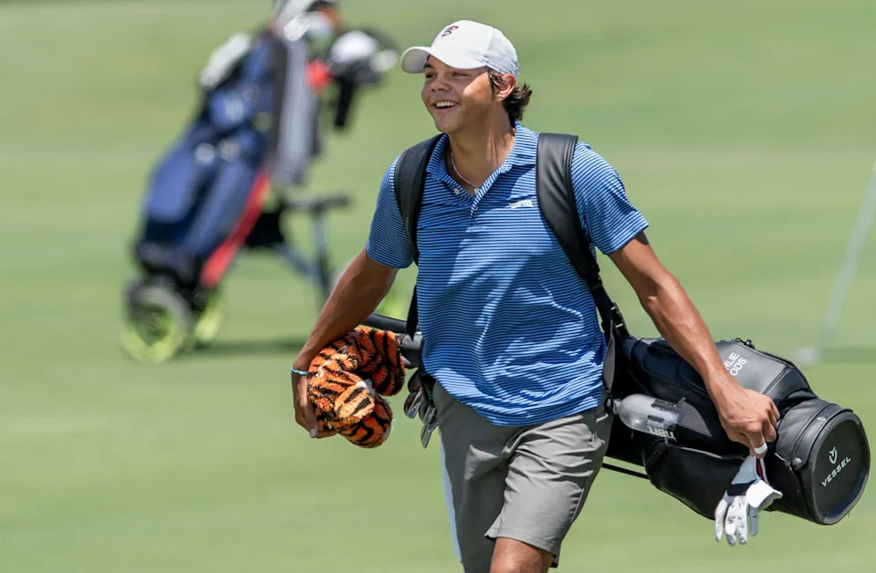 Charlie Woods smiles as he walks the fairway during the 41st Nicklaus Junior Championship at the Tequesta Country Club on June 23, 2025 in Tequesta, Florida.