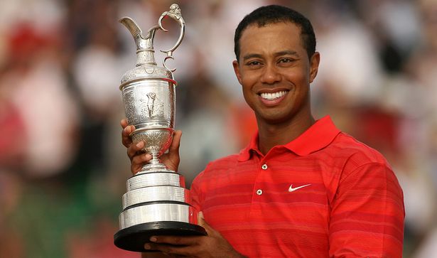 Tiger Woods holding the Claret Jug