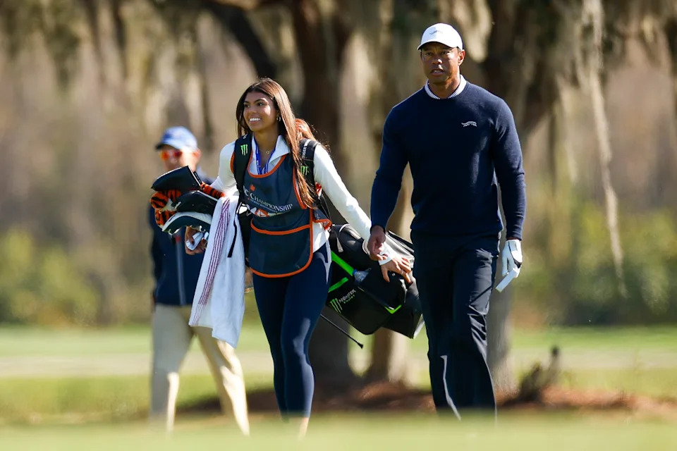 ORLANDO, FLORIDA - DECEMBER 21: Tiger Woods and his daughter Sam Woods walk the 11th hole during the first round of the PNC Championship at Ritz-Carlton Golf Club on December 21, 2024 in Orlando, Florida. (Photo by Mike Ehrmann/Getty Images)