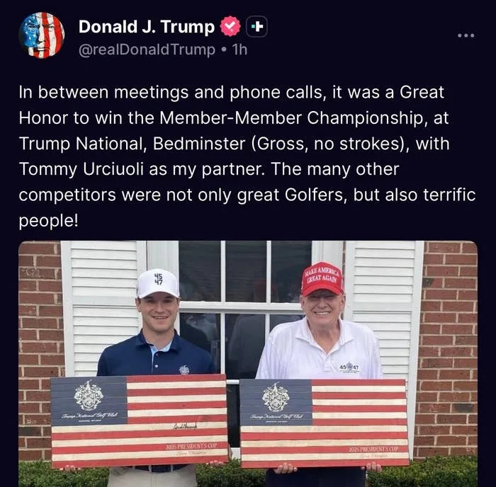 Two men in casual attire holding American flag-themed boards, standing outdoors. The tweet discusses a golf championship participation