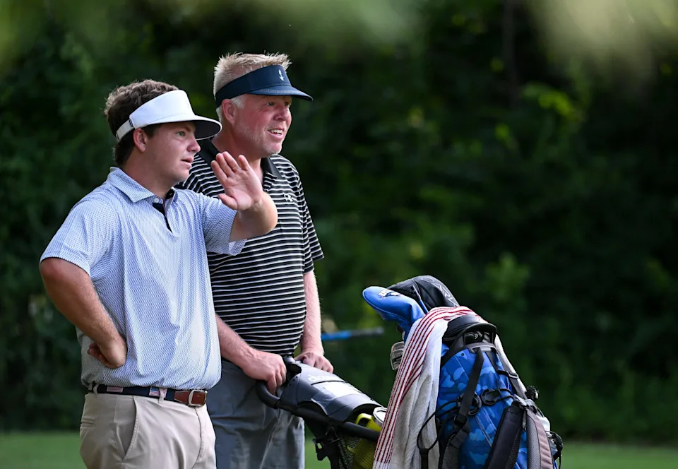 Jason Bannister and caddie Lance Ringler discuss a shot during the semi-finals in the Men's Championship division in the City Golf Tournament at Cascades Golf Course on Saturday, July 12, 2025.