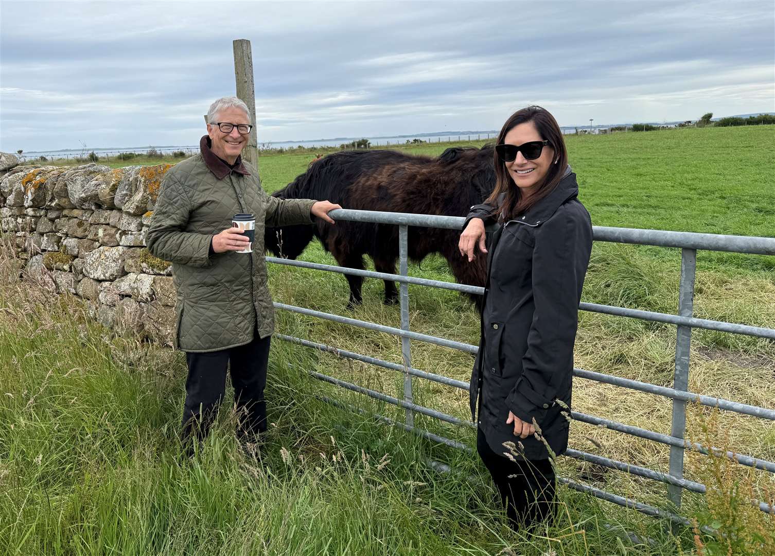 Bill Gates and Paula Hurd at a nearby farm after a visit to Dornoch.