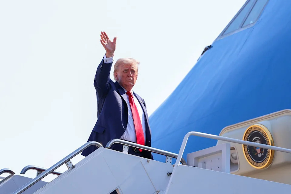 Trump waved as he boarded Air Force One on Friday, as he departed for Scotland, at Joint Base Andrews (Reuters)