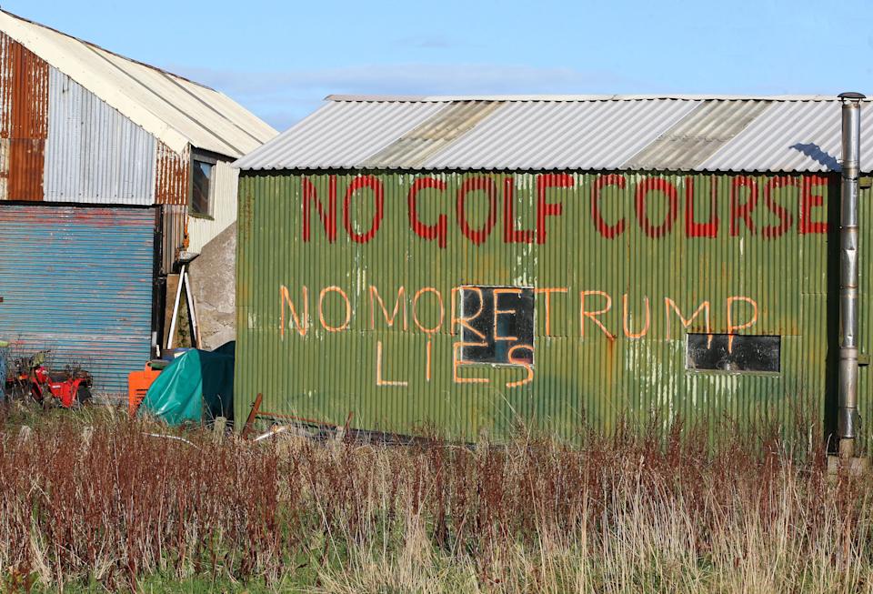 A sign on a farm building near the Menie Estate in opposition to US property tycoon Donald Trump's controversial luxury golf resort.
