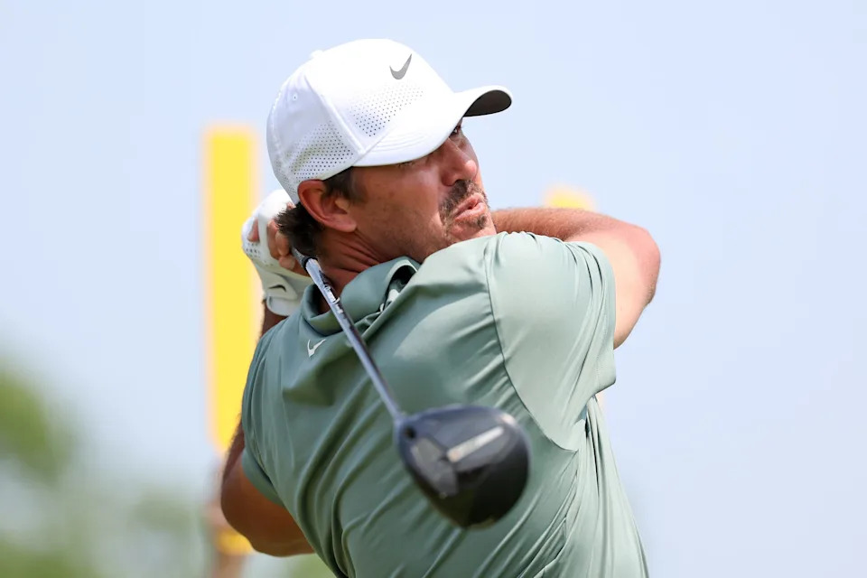 Brooks Koepka plays his shot from the ninth tee during the first round of the U.S. Open golf tournament.