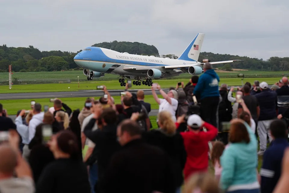 Crowds watch as Donald Trump lands at Prestwick airport as he visits his Turnberry golf course in South Ayrshire (Jane Barlow/PA Wire)