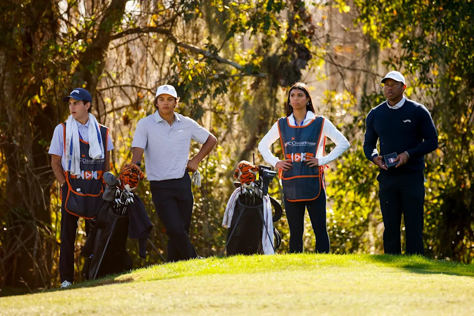 ORLANDO, FLORIDA - DECEMBER 21: Tiger Woods, his daughter Sam Woods, son Charlie Woods and family friend Luke Wise look on while playing the 13th hole during the first round of the PNC Championship at Ritz-Carlton Golf Club on December 21, 2024 in Orlando, Florida. (Photo by Mike Ehrmann/Getty Images)