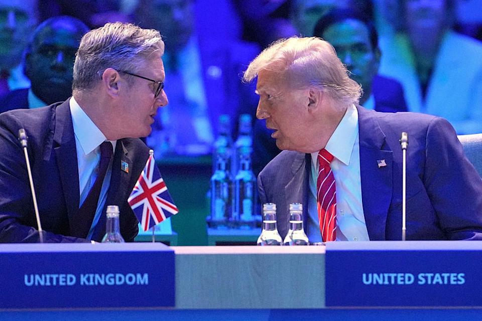 US president Donald Trump speaks to British prime minister Keir Starmer during the NATO summit last month (Getty)