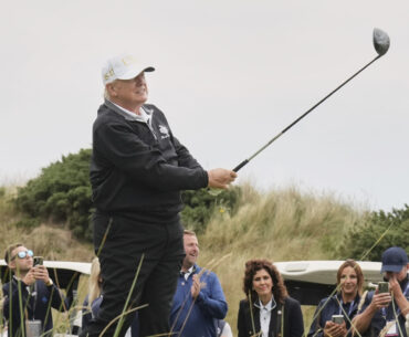 President Donald Trump tees off during the opening ceremony for the Trump International Golf Links ...