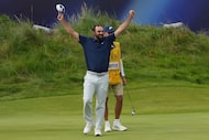 Scottie Scheffler of the United States celebrates after winning the British Open golf...