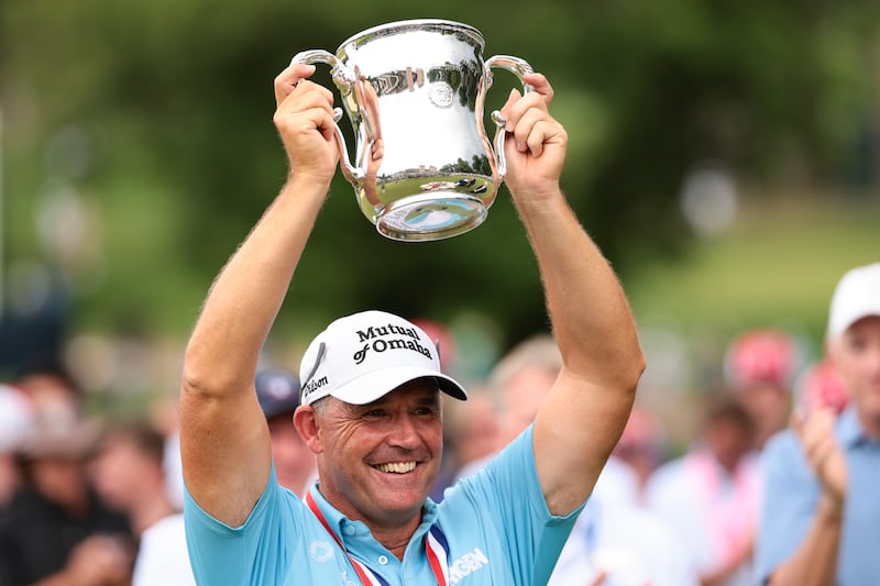 COLORADO SPRINGS, COLORADO - JUNE 29: Padraig Harrington of Ireland hoists the Francis D. Ouimet Memorial Trophy after winning the U.S. Senior Open Championship 2025 at Broadmoor Golf Club on June 29, 2025 in Colorado Springs, Colorado. (Photo by Andrew Wevers/Getty Images)
