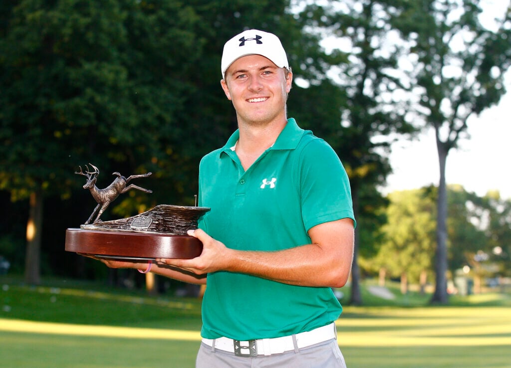 Jordan Spieth holds the trophy after winning the 2013 John Deere Classic