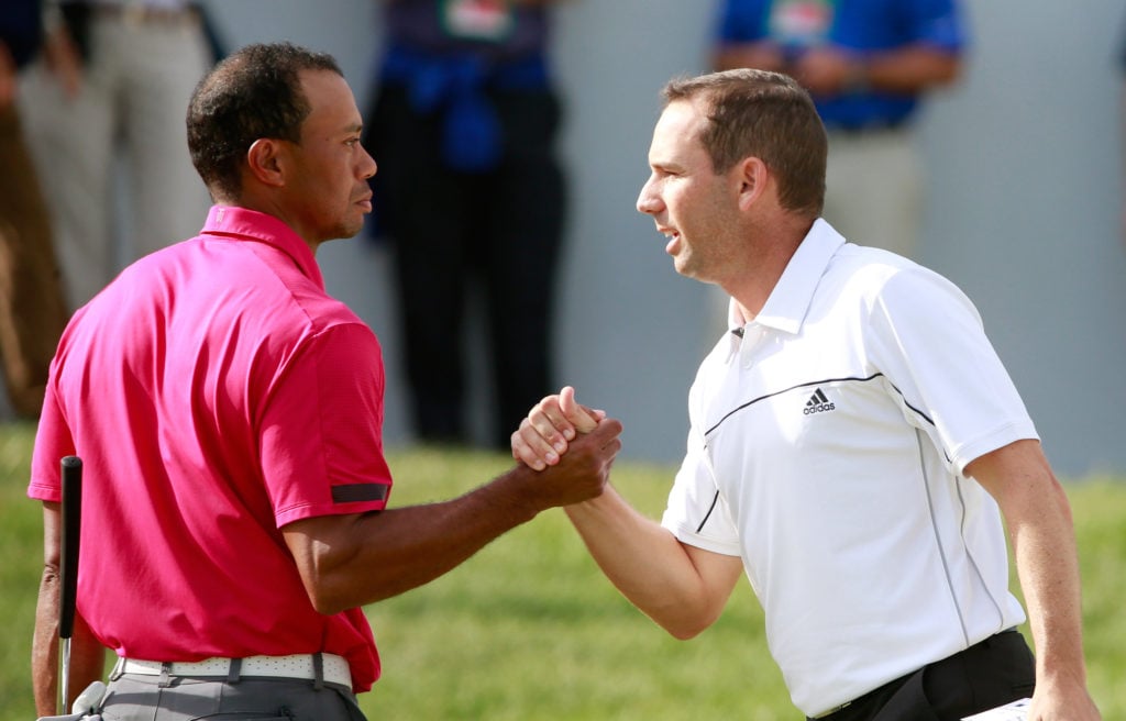 Tiger Woods shakes hands with Sergio Garcia after the third round of the BMW Championship in 2013