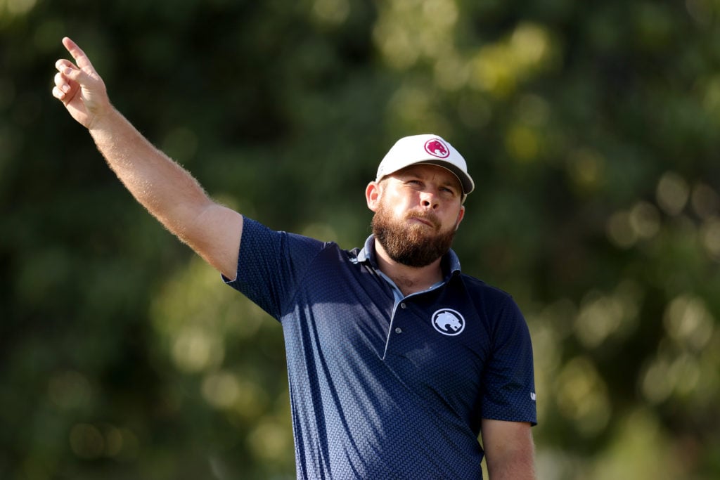 Tyrrell Hatton points right at the Hero Dubai Desert Classic