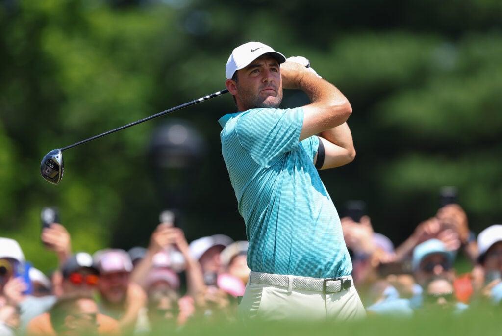 Scottie Scheffler hits his driver on the first hole at TPC River Highlands during the final round of the Travelers Championship