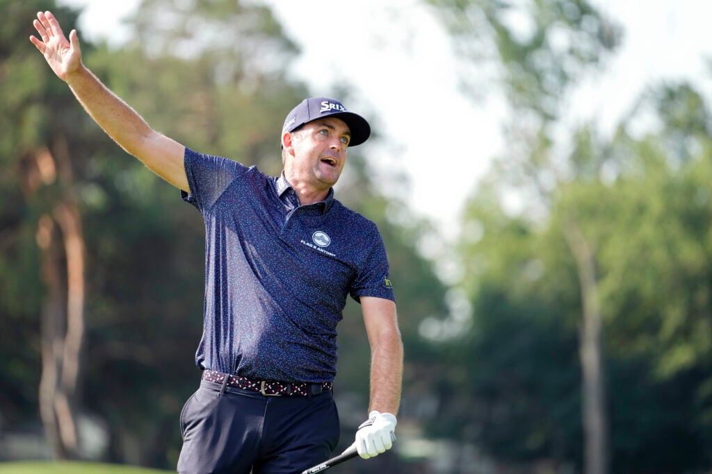 Keegan Bradley reacts after hitting his tee shot on the 17th hole during the first round of the Rocket Classic